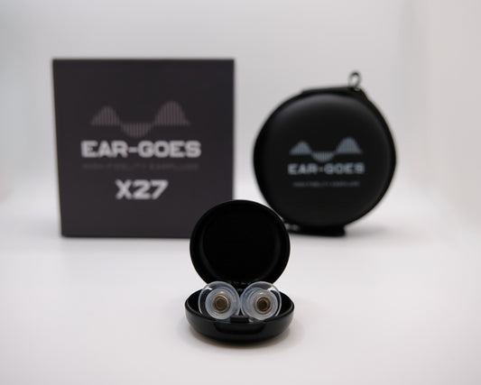 Ear-Goes X27 earplugs in open black case with a black box and round case in the background